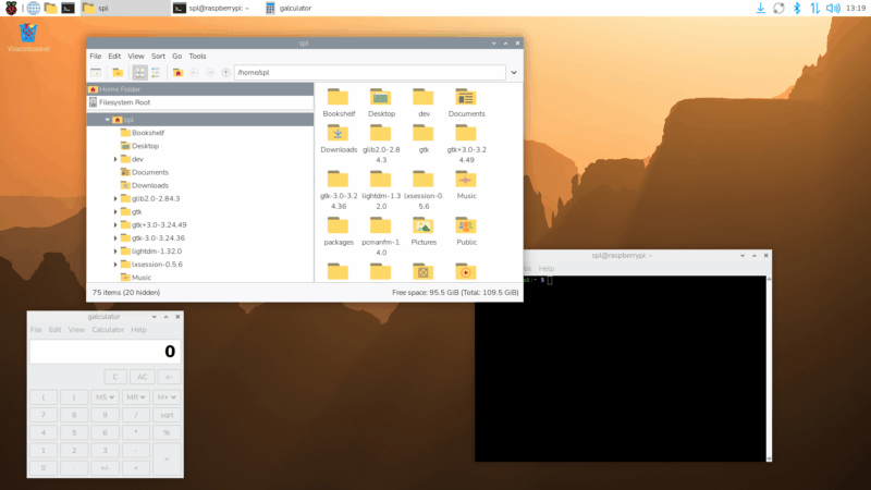 The Raspberry Pi OS Trixie desktop with the new wallpaper, icons, and font